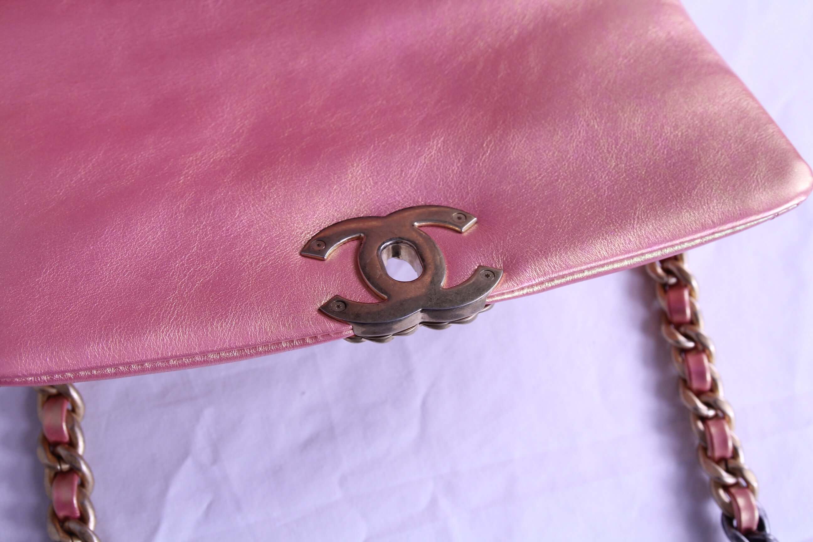 Hardware of Medium Chanel handbag in finished in metallic pink