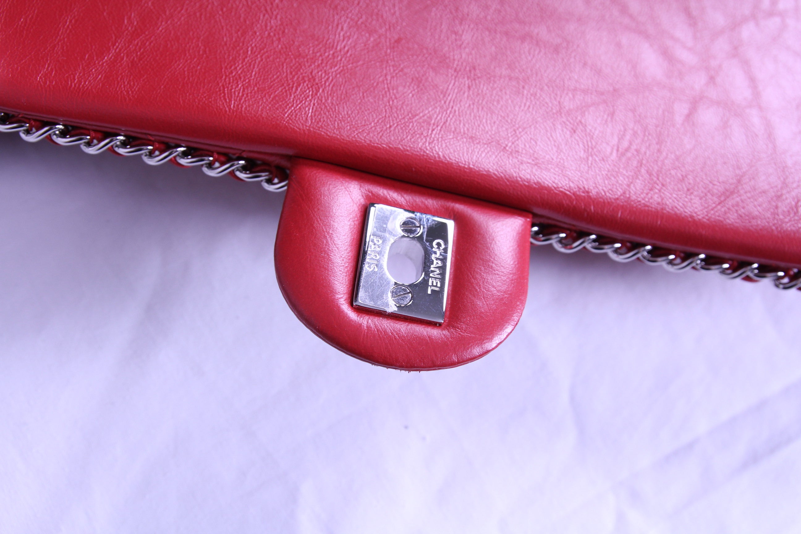 Hardware of large Chanel flap finished in aged red calfskin