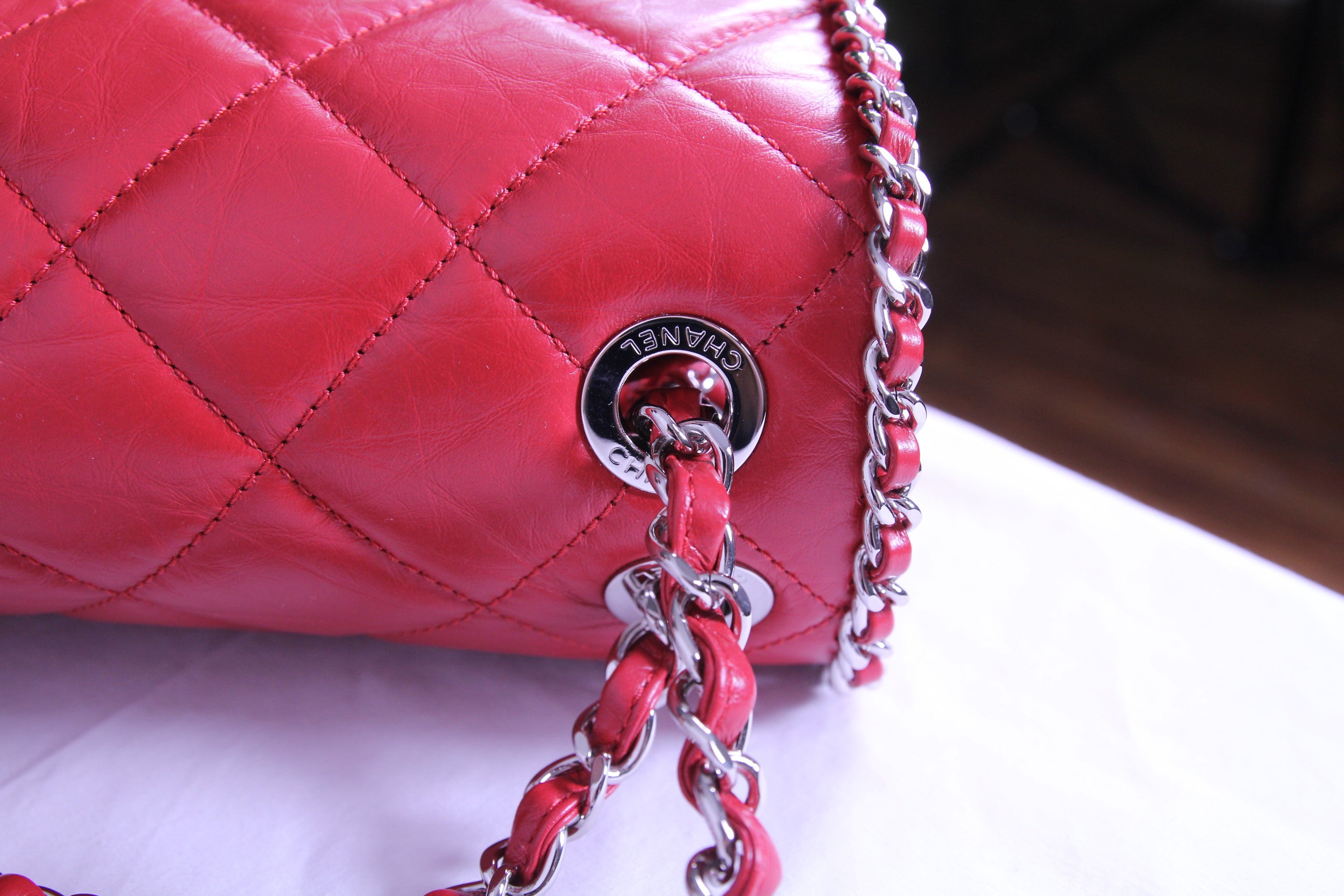 Top of large Chanel flap finished in aged red calfskin