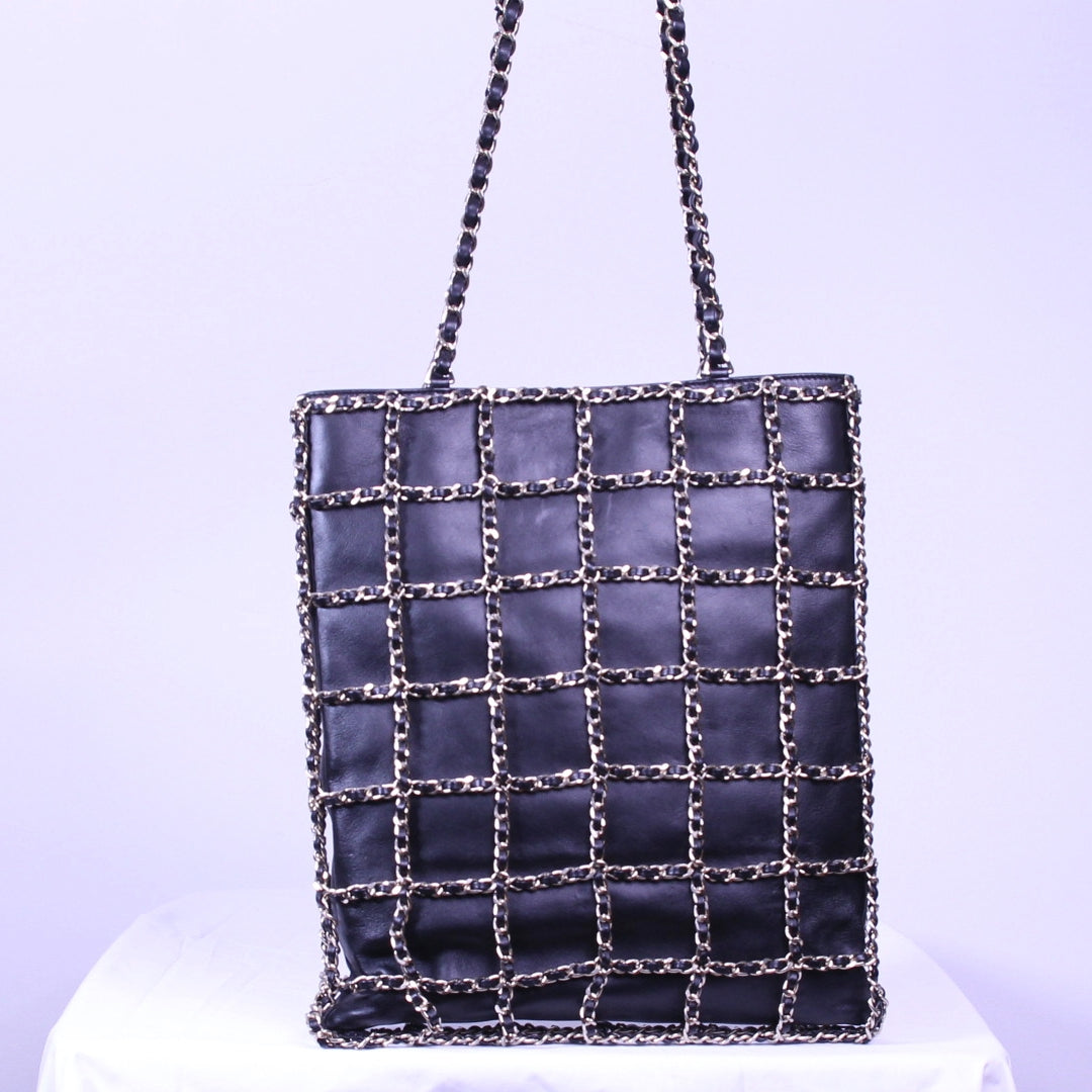 Back of Chanel caged tote finished in black calfskin