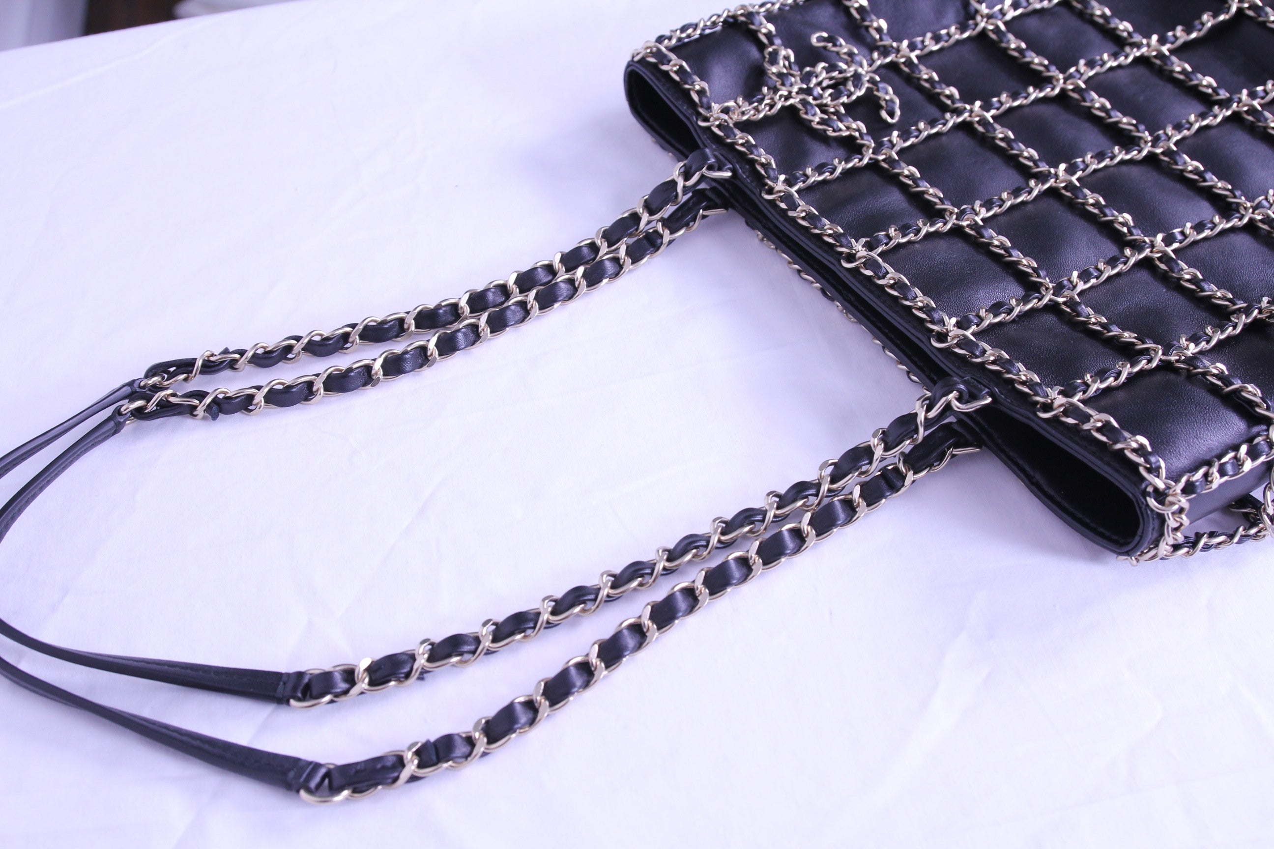 Top of Chanel caged tote with chain finished in black calfskin