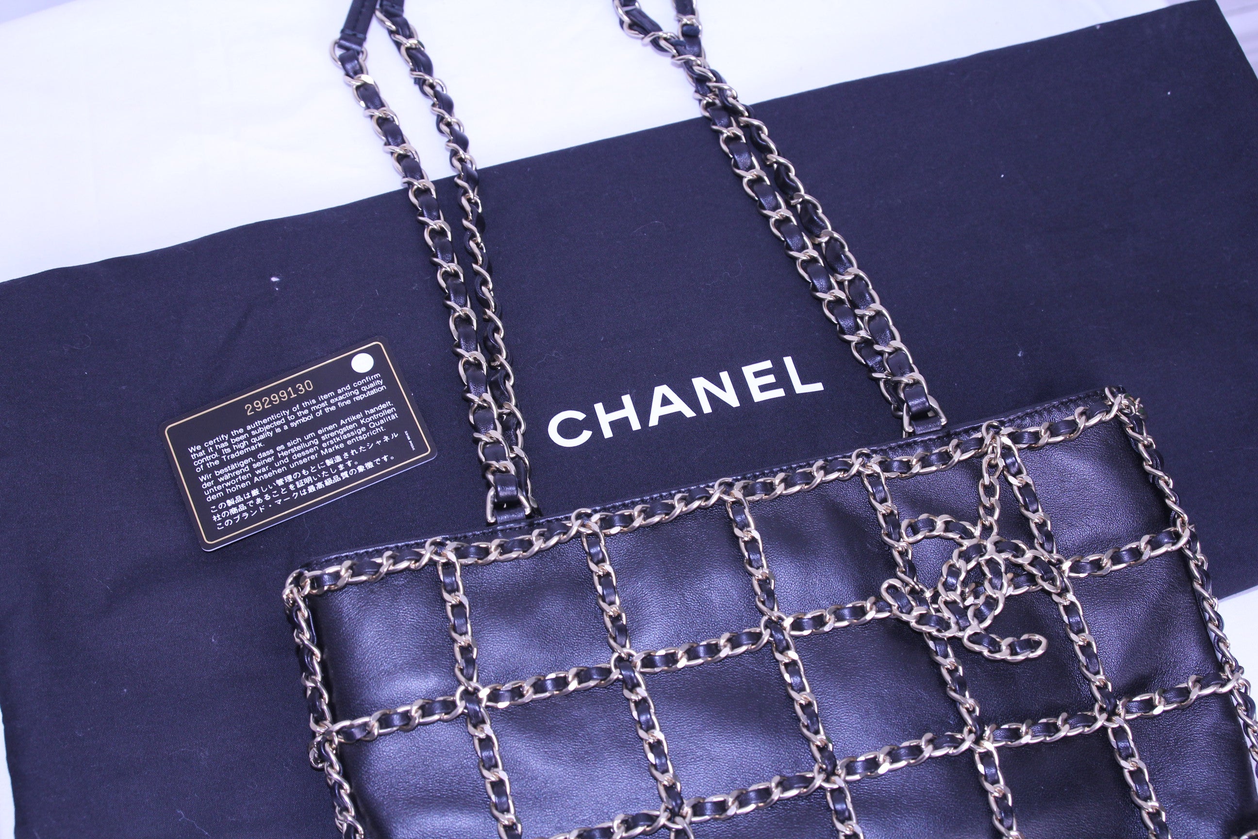 Front of Chanel caged tote finished in black calfskin with authenticity card and dustbag