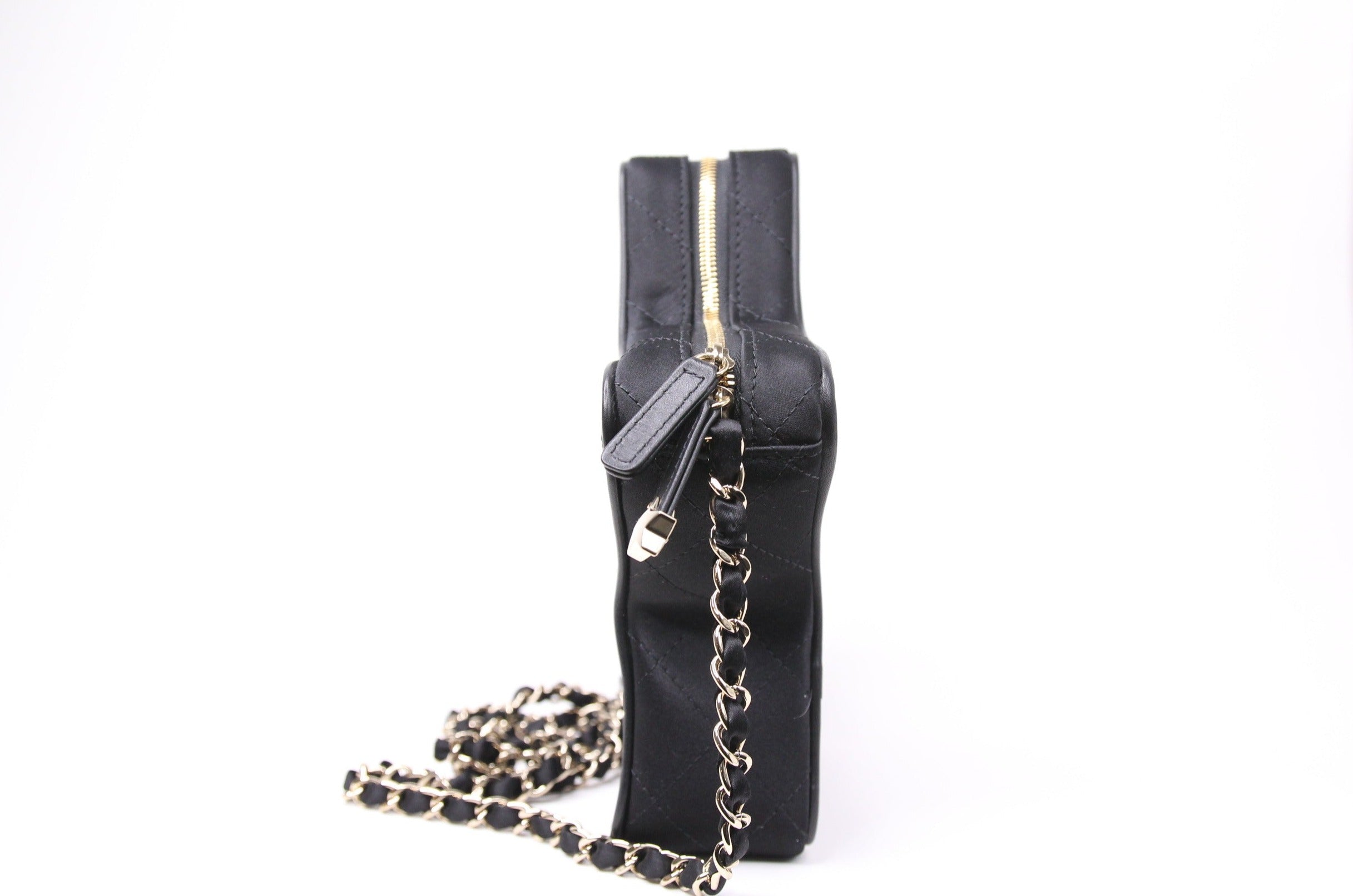 Side of Chanel star handbag in finished in black satin