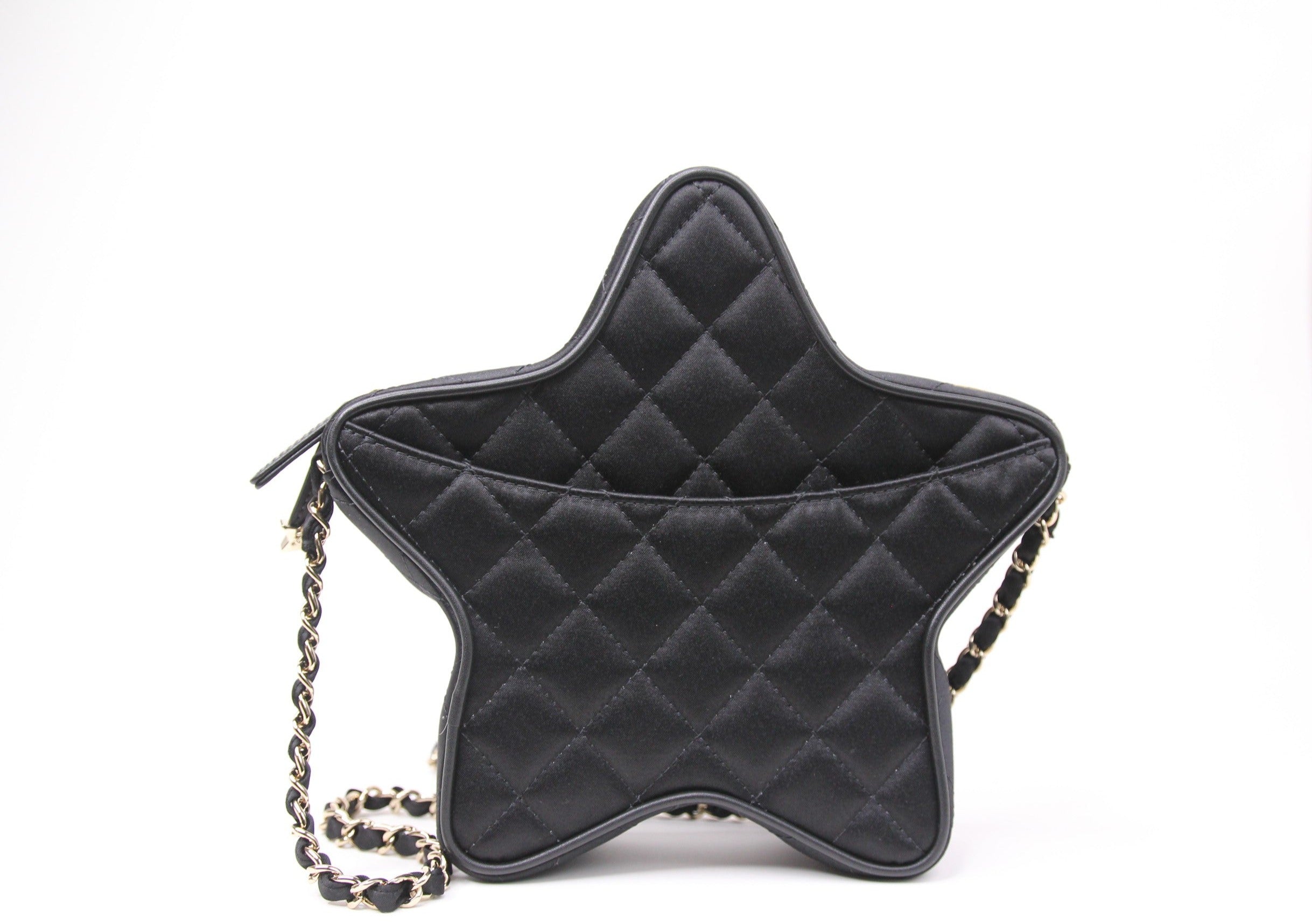 Back of Chanel star handbag in finished in black satin