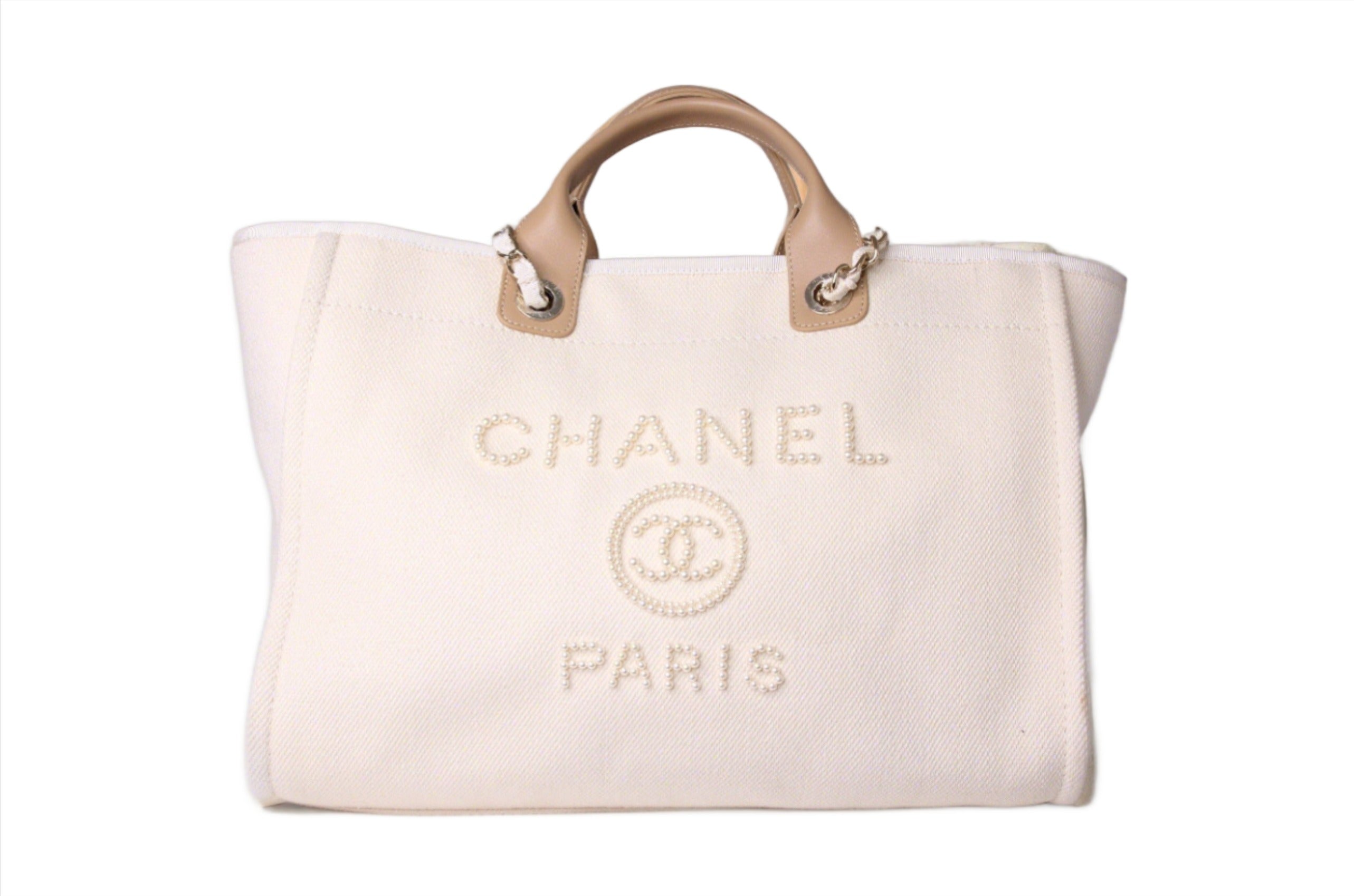 Front of large Chanel deauville tote in ecru beige pearl canvas